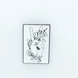 Retro black and white enamel brooch with hand-drawn floral hand gesture for bags