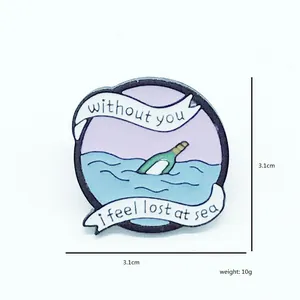 Enamel drift bottle brooch with Without You text in a round starry ocean design