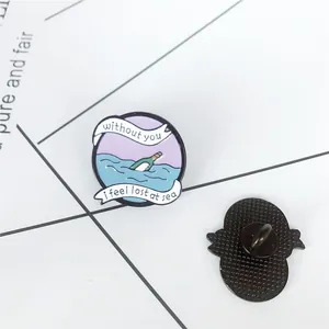Detail showing the front enamel waves and back butterfly clutch of the round sea bottle pin