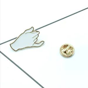 Cartoon pinky promise gesture enamel pin in white and black for denim jackets