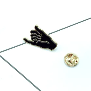 Black enamel pinky promise gesture brooch pin with gold metal trim for jackets