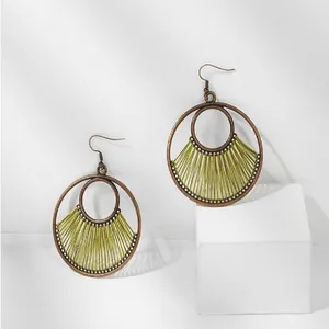 Bohemian geometric double hoop drop earrings with yellow-green woven fan pattern detail