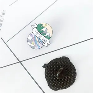 Enamel brooch with dusk till dawn mountain design on round pin and butterfly clasp