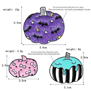 Three-piece Halloween enamel pin set featuring pumpkin, bat and star designs on white backdrop