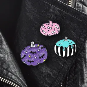 Halloween enamel pin set featuring pumpkin bat and bone designs on black leather jacket