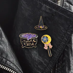 Three-piece Halloween Sweet Witch enamel pin set featuring hat, cauldron, and magic wand