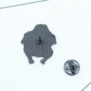 Fashionable dog badge brooch with a textured black metal back and secure butterfly clutch