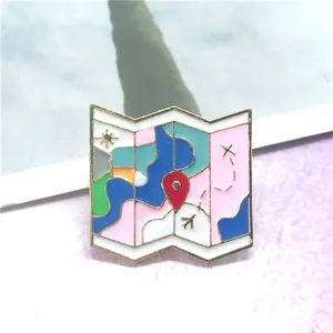 Colorful cartoon enamel map brooch with airplane and red location icons in gold trim
