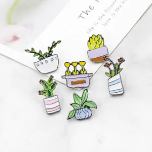 6-piece set of cartoon cactus and succulent metal enamel pins on marble background