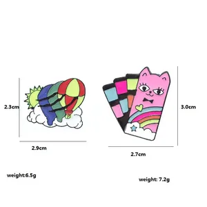 Cartoon enamel pins set featuring a striped hot air balloon and a pink cat on white background
