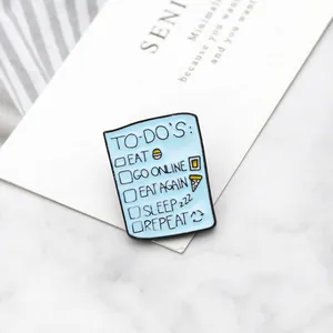 Detail of creative enamel pin with blue To-do List design on marble background