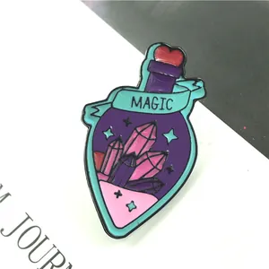 Close-up of a purple magic potion enamel pin with crystals and a MAGIC ribbon banner