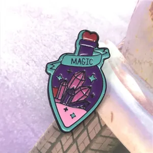 Macro shot of purple enamel magic potion bottle pin with MAGIC text and heart stopper