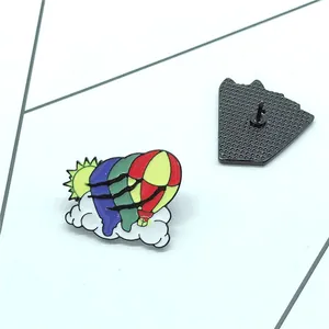 Colorful cartoon enamel brooch with hot air balloon and sun on white background
