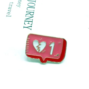 Detail of pink notification bubble enamel pin with broken heart icon and white number one