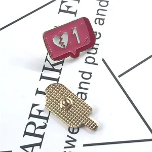 Pink enamel notification badge lapel pin featuring a broken heart and gold metal back