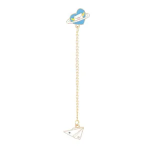 Detail of blue heart and paper plane earring with planet motif and gold chain