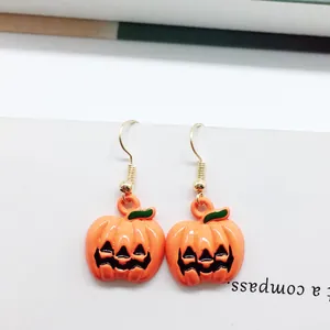 Halloween pumpkin drop earrings in bright orange enamel with festive golden hooks