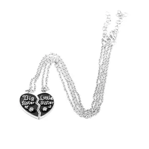 Big Sister and Little Sister heart necklaces set with black enamel and rhinestones