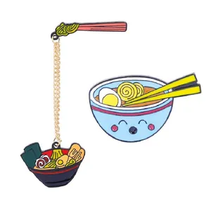 Cartoon enamel ramen bowl pins with gold chain, featuring noodle and chopsticks design