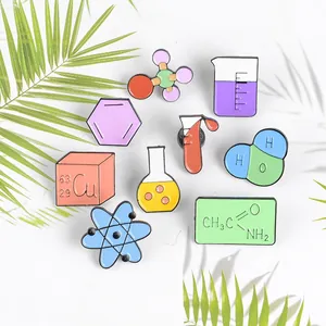 9-piece set of creative science enamel pins with chemistry flasks and atomic models