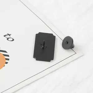 Rear view of rectangle pin with matte black finish and secure rubber clutch backing