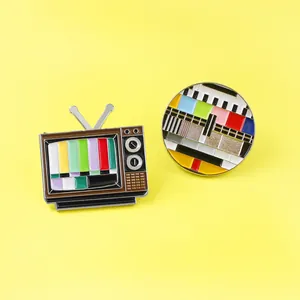 Vintage TV set enamel pin set with colorful signal patterns on bright yellow background