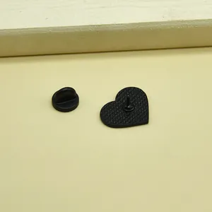 Black heart-shaped enamel brooch with non-slip texture back and rubber clutch pin backing