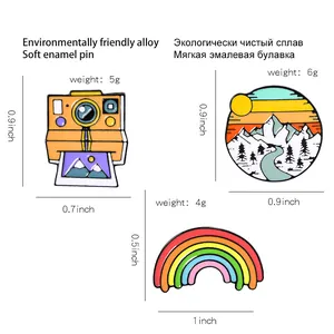 Cartoon camera, snow mountain, and rainbow enamel lapel pins in alloy material