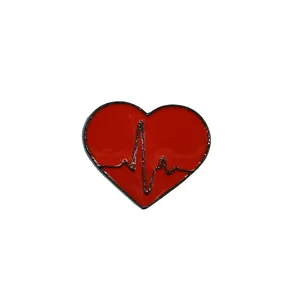 Minimalist red heart brooch with EKG heartbeat line design on white background