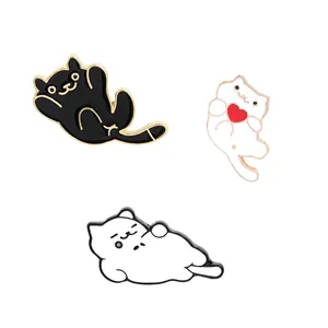 Three cute cartoon cat enamel pins in black and white styles for fashion decoration