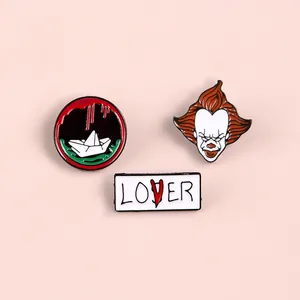 Three-piece Pennywise clown enamel pin set featuring movie elements and lover text