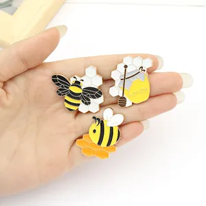 Three-piece cute bee and honey enamel pin set with hexagon honeycomb and honey jar