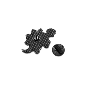 Back view of dinosaur enamel pin with matte black finish and secure rubber clutch backing