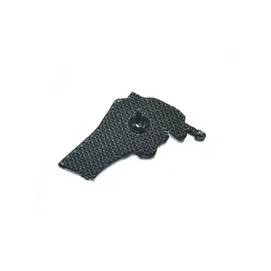 Back view of cartoon hand metal badge featuring matte black texture and safety pin needle