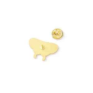 Back view of gold plated butterfly brooch with secure pin clasp on white background