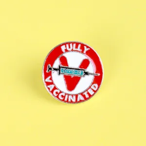 Fully Vaccinated COVID-19 round enamel syringe brooch pin with red V on yellow background