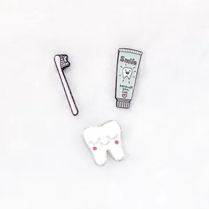 Cute cartoon tooth toothbrush enamel pin set with smile quote on a white background