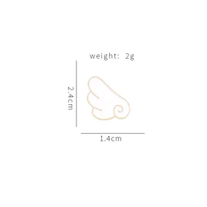 Cartoon angel wing enamel brooch with gold trim measuring 2.4cm by 1.4cm