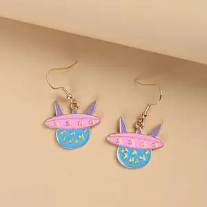 Cartoon UFO spaceship drop earrings with pink and blue enamel and gold stars