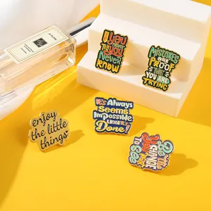 Five vintage alloy enamel inspirational quote pins set on a yellow background stairs