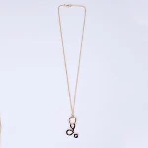 Creative gold stethoscope pendant necklace for medical professionals with black oil finish