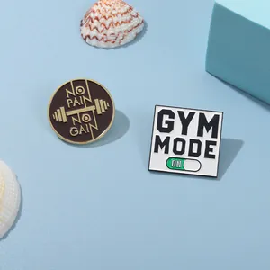 Gym theme enamel pins featuring No Pain No Gain and Gym Mode On slogan designs