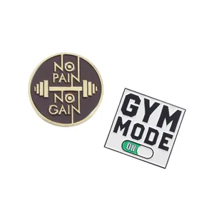 Detailed enamel pins featuring GYM MODE and NO PAIN NO GAIN fitness motivational slogans