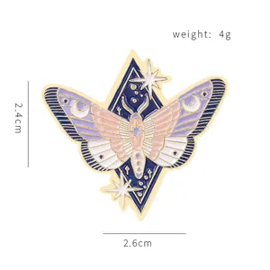 Enamel Luna Moth brooch with celestial starry night wings and golden finish details