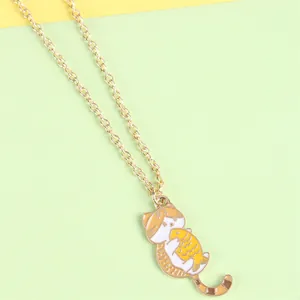 Cute cartoon cat holding fish pendant necklace with gold chain and colorful enamel finish