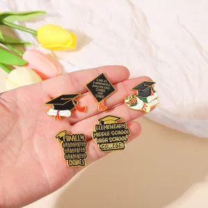 Set of 5 graduation enamel pins featuring caps, diplomas and books held in hand