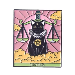 Macro detail of Justice Tarot black cat enamel pin with sword and scales patterns