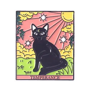 Close-up of a rectangular tarot badge featuring a black cat and Temperance text