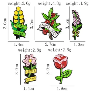 Set di cinque spille smaltate a fiori colorati con motivi botanici e misure